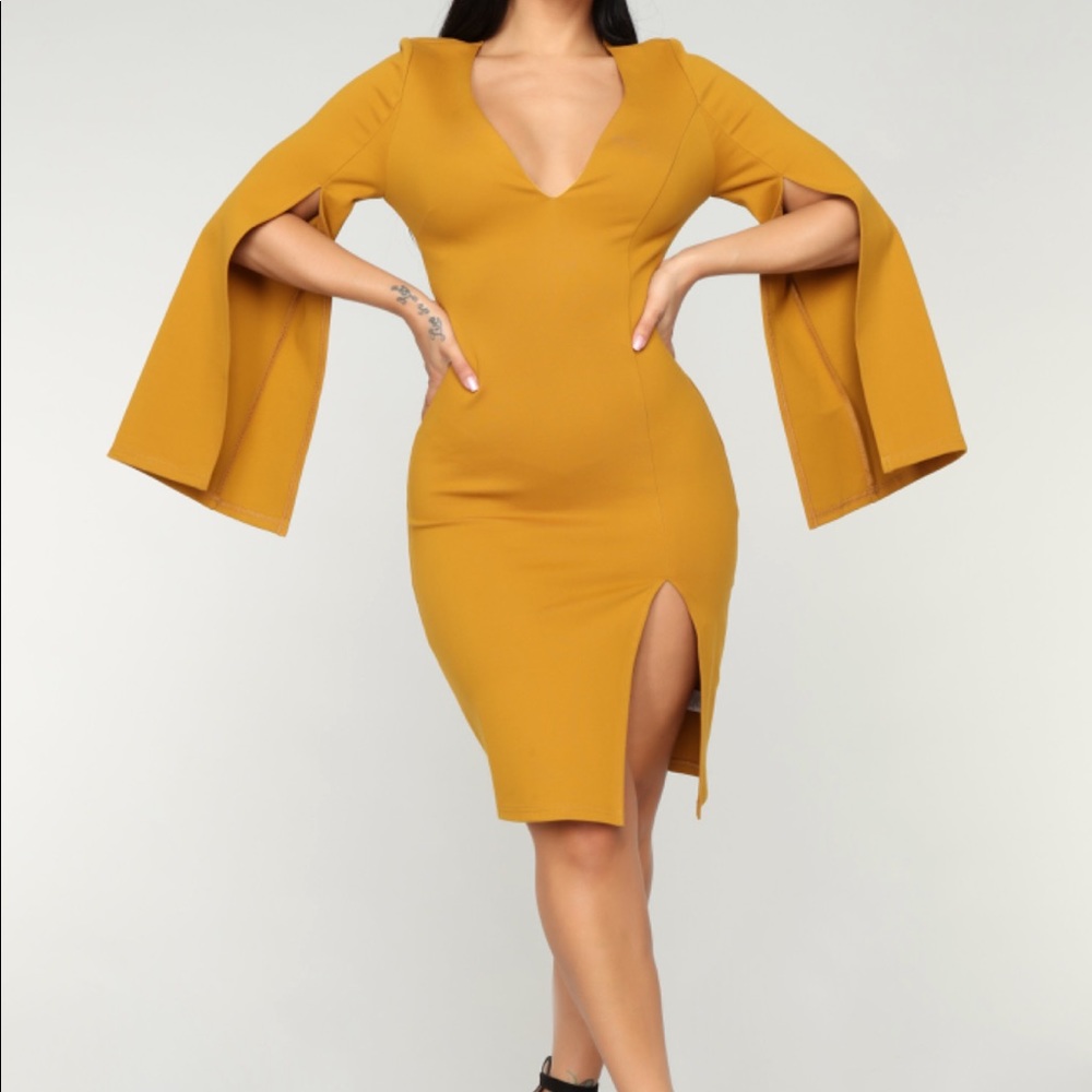 yellow dress with slit on arms and legs, worn once